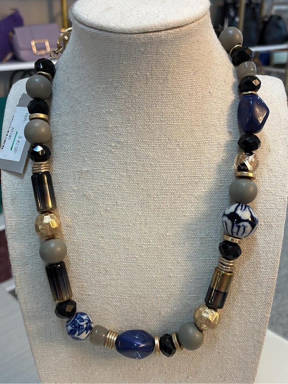 Blue, gray, black, gold necklace is Sparkle Design